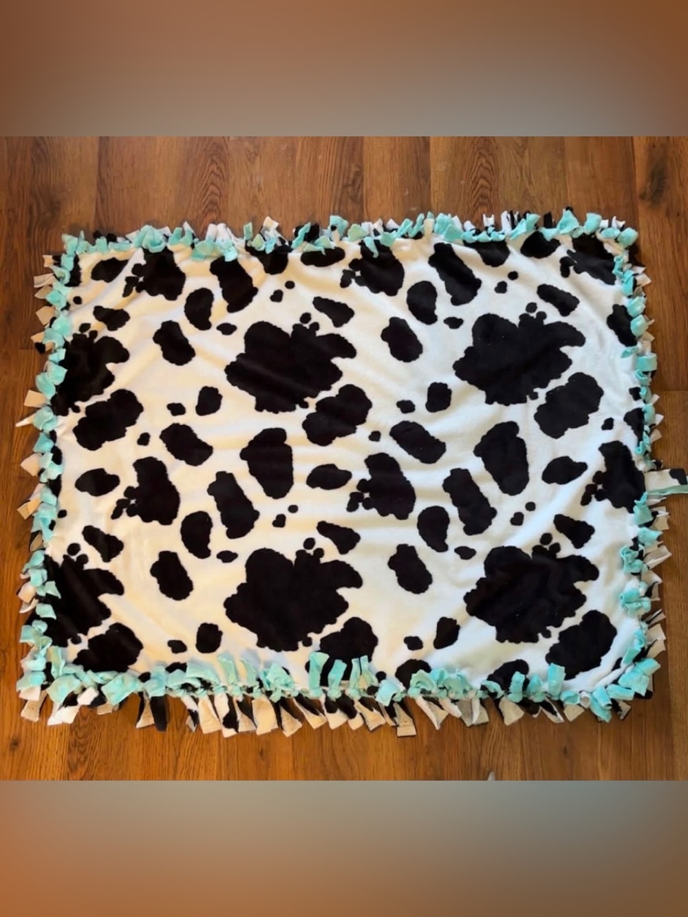 Cow Print Baby Tie-Edge Blanket - Black & White with Aqua Trim